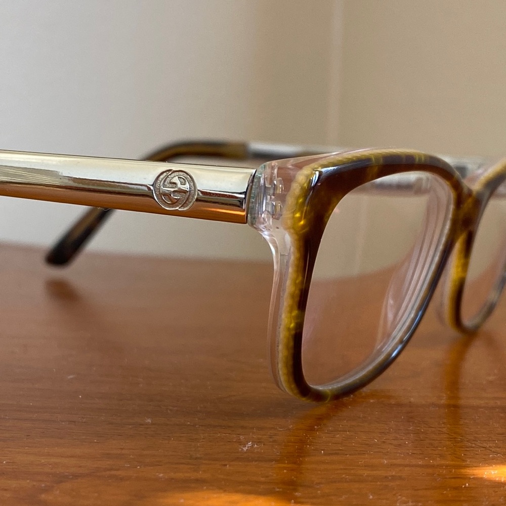 Gucci prescription glasses. Snakeskin pattern. Gold  and tortoise arms.